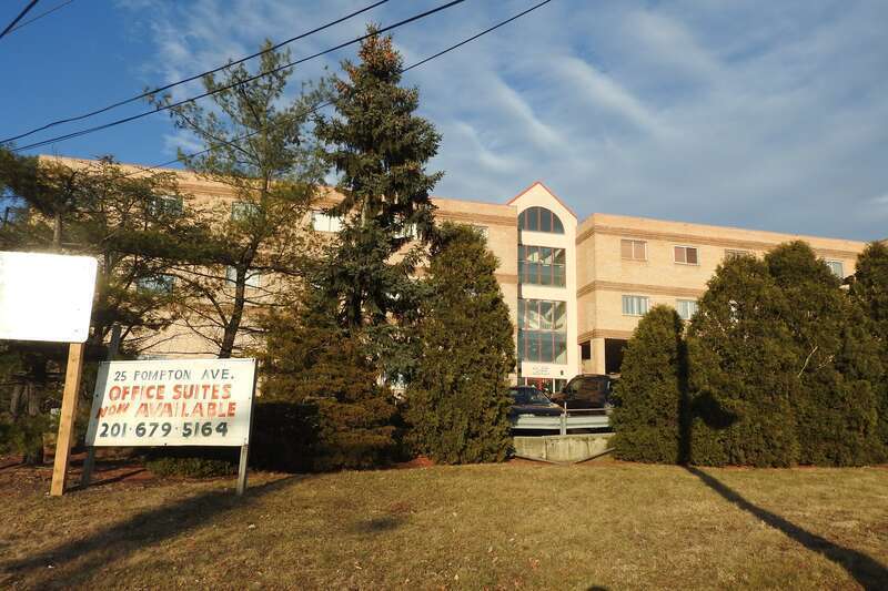 Looking east at office building west of former hotel site