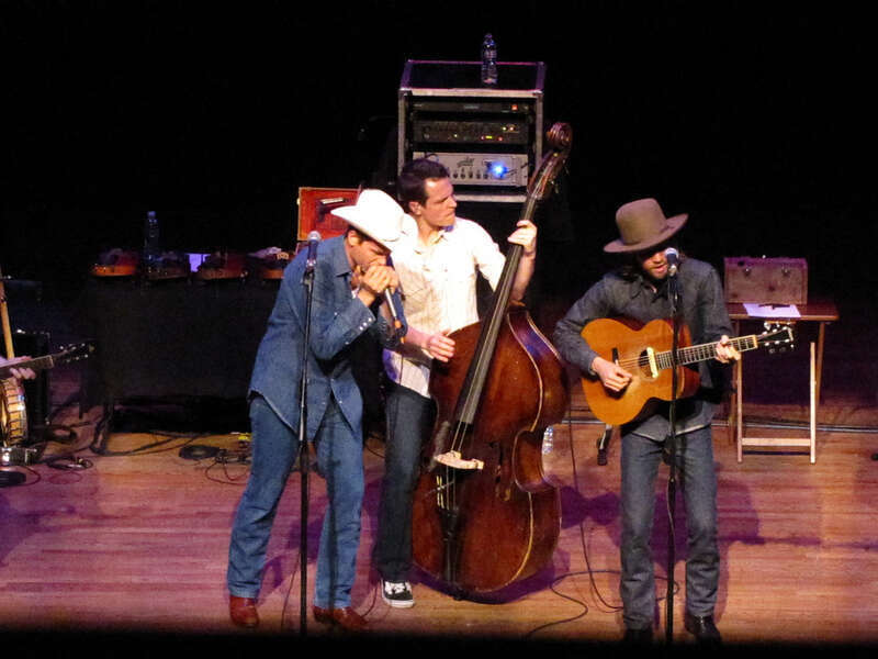 Ketch Secor (harmonica), Morgan Jahnig (double-bass), and Willie Watson (guitar) of Old Crow Medicine Show at the Tivoli Theatre in Chattanooga, Tennessee on May 5, 2010.
