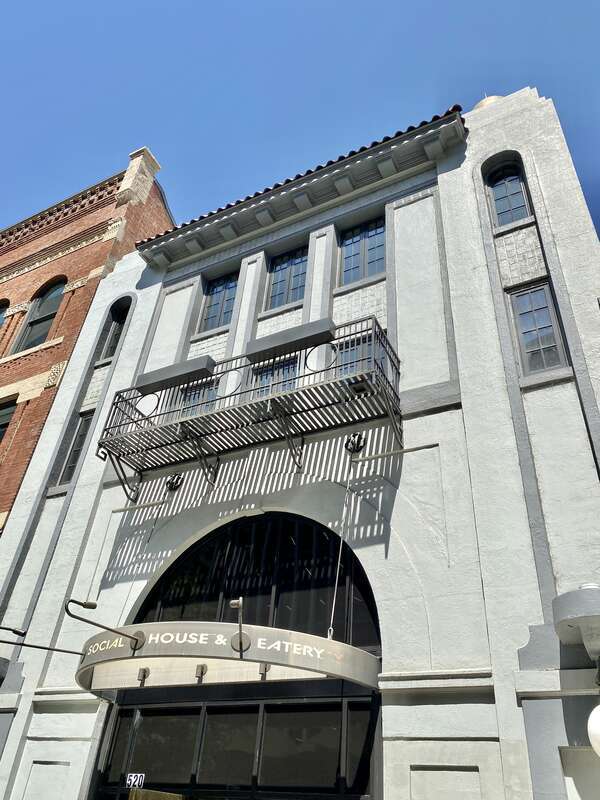 Built in 1924, this Mission Revival-style building was designed by J. W. Alexander to serve as the Ritz Theater, a movie theater.  The building served as a movie theater until 1973, operating under the name of Cinema 63 from 1962 onwards.  The