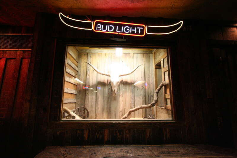 Rattlesnakes at the Dixie Chicken in College Station Texas. Now, who thought it was a good idea to keep a bunch of rattlesnakes at a bar behind a pane of glass and under a bud light sign is completely beyond me. But it made sense when I went to