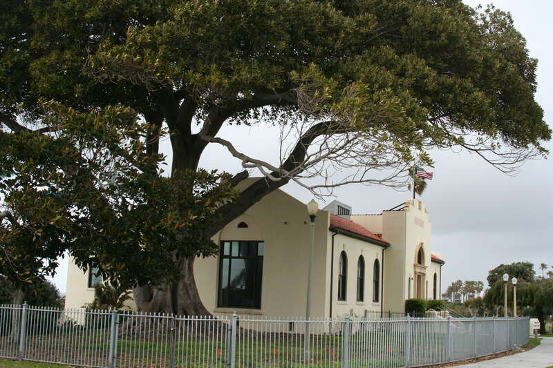 The original main library in Redondo Beach California from the Southeast including the Moreton Bay Fig Tree adjacent to it. Photo taken February 2010
