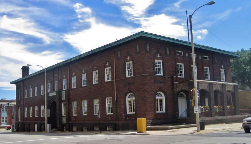 Rockford Elk's Lodge #64 (1912). It was built to resemble the American Insurance Company building across the street. However, high costs resulted in a more restrained, modern design.