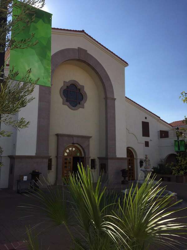This photo of Saint Joseph Husband of Mary Catholic Church in Las Vegas Nevada shows the exterior along with a portion of the plaza. There is a fountain. There are other features in the plaza not in the photo.