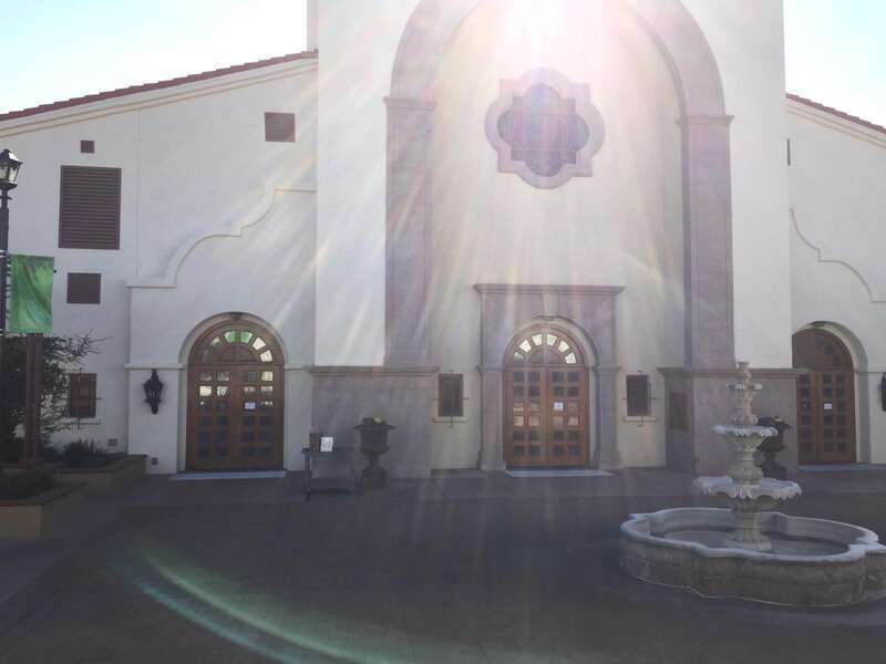 This photo of Saint Joseph Husband of Mary Catholic Church in Las Vegas Nevada shows the exterior along with a portion of the plaza. There is a fountain. There are other features that are not in the photo.This photo has different angle and lighting