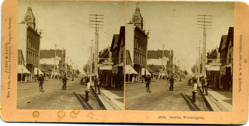 Despite what the card says this is actually Olympia , Washington.
I believe this is looking north on Capitol Way S from 5th ave.

Much thanks to Severinus and Litlnemo for figuring this one out.