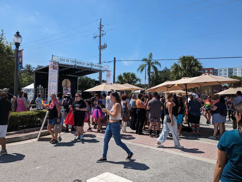 Stage and shade umbrellas set up during Space Coast Pride