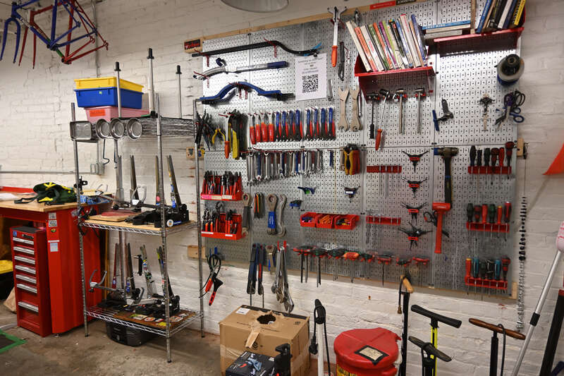 Various bicycle repair tools on a tool wall at Somerville Bike Kitchen, a bike co-op in Somerville, Massachusetts.