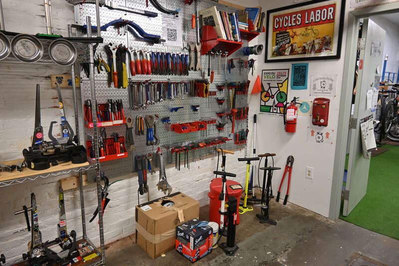 Various bicycle repair tools on a tool wall at Somerville Bike Kitchen, a bike co-op in Somerville, Massachusetts.