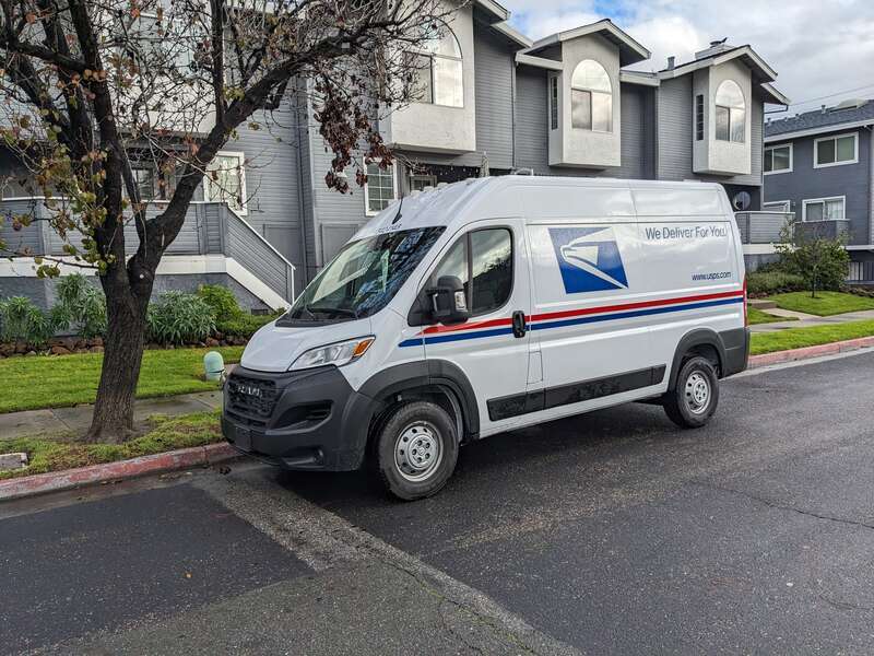 A USPS delivery van parked on Duncanville Court in Campbell, California.