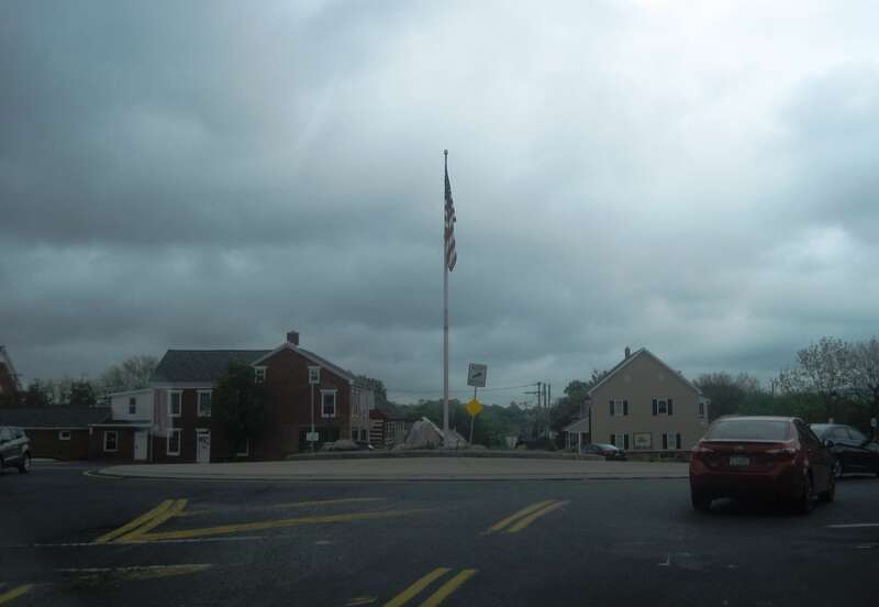 Photo of eastbound U.S. Route 30 (King Street) in Abbottstown, Pennsylvania approaching the roundabout at the center of the borough. Photo taken looking east-northeast between Cheapside Street and Pennsylvania Route 194 (Queen Street).