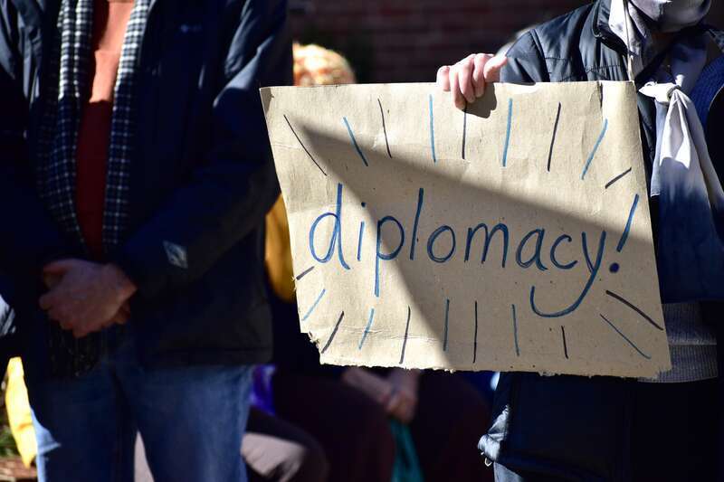 Over 50 people gather at Peace and Justice Plaza across the street from UNC-Chapel Hill to protest actions that might lead to a war with Iran.
