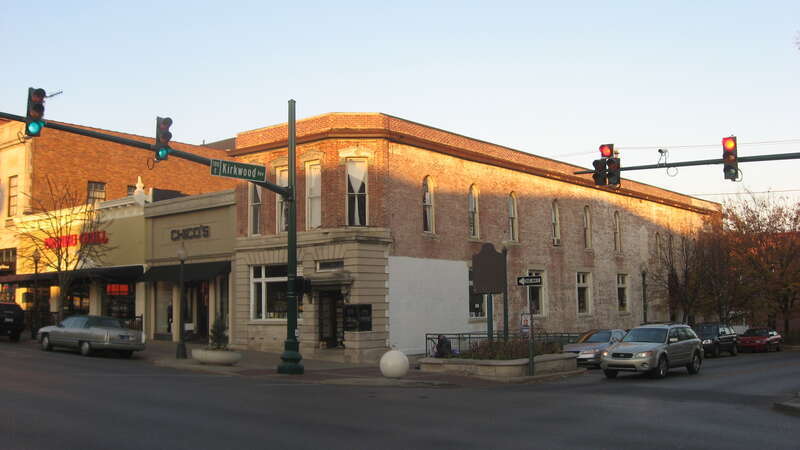 Front and southern side of the building at 100 N. Walnut Street in downtown Bloomington, Indiana, United States.  Built in 1888 as the Monroe County State Bank and since converted into a bookstore, it is part of the Courthouse Square Historic