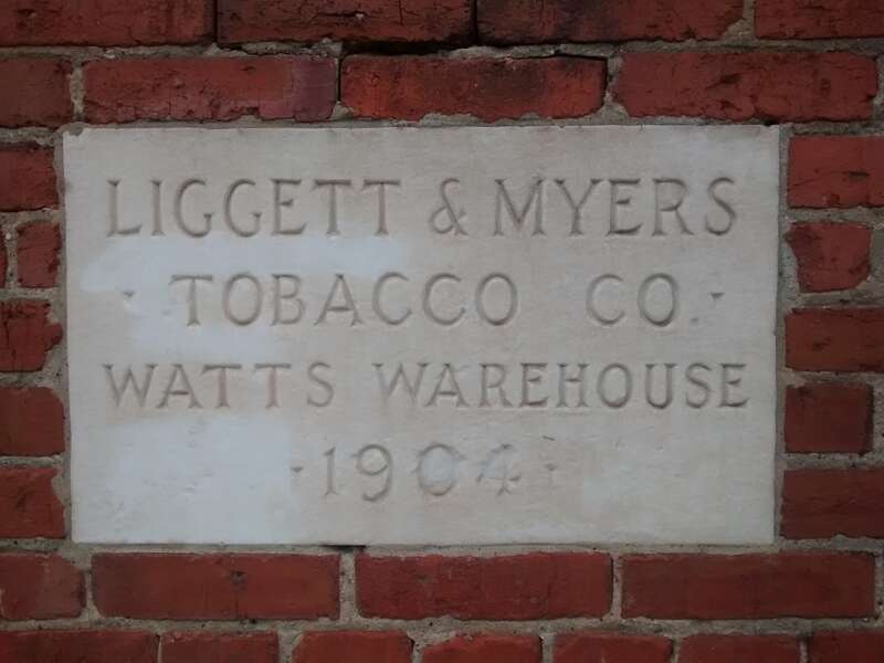 The plaque on the corner of Watts Warehouse in Durham, North Carolina.