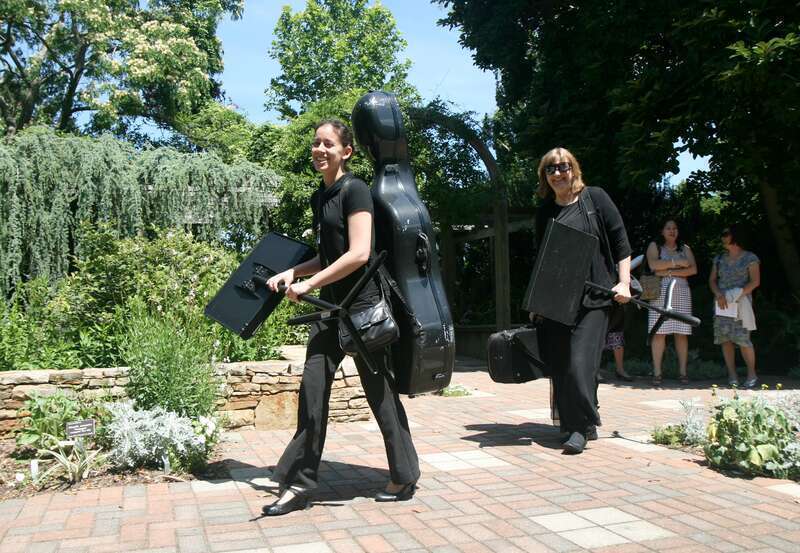 Musicians leaving after playing at a wedding held at the J. C. Raulston Arboretum in Raleigh, North Carolina.