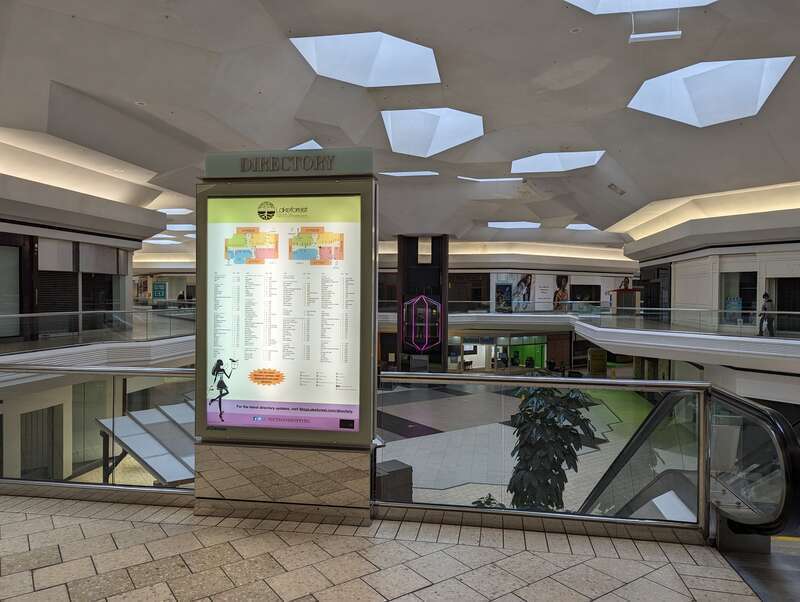 The lighted directory for Lakeforest Mall with the glass elevator and the center mall area behind it on the last day Lakeforest was open. 701 Russell Avenue, Gaithersburg, Maryland.