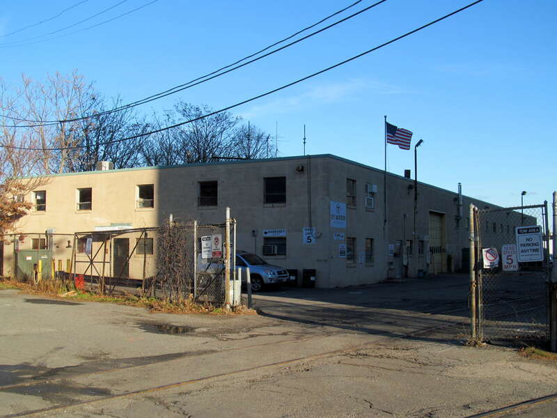 MBTA tire facility at 21 Water Street in Cambridge. This building will be demolished as part of Phase I of Green Line Extension construction.