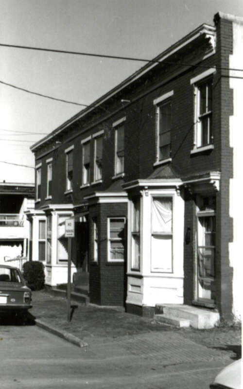 Address/Title: 519 - 521 - 523 St. James Street
Photographer: Zehmer, John G. (John Granderson), 1942-
Original Description (from Book): An unusually long row of small dwellings, each has a one level projecting wooden bay. This row is
