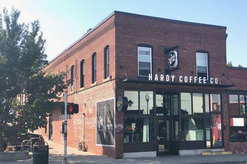 The European Hotel is a two-story brick two-part commercial block with a flat roof and rectangular plan.