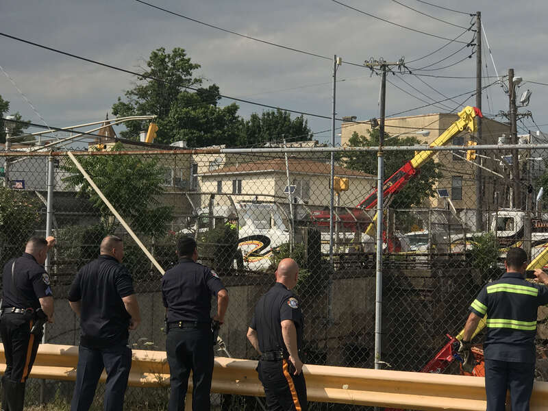 Scene of a July 3, 2019 vehicular accident at 30th Street and Palisade Avenue in Union City, New Jersey, where just before 1pm EST, an orange Union City Department of Public Works garbage truck careened across two sidewalks, knocking down a utility