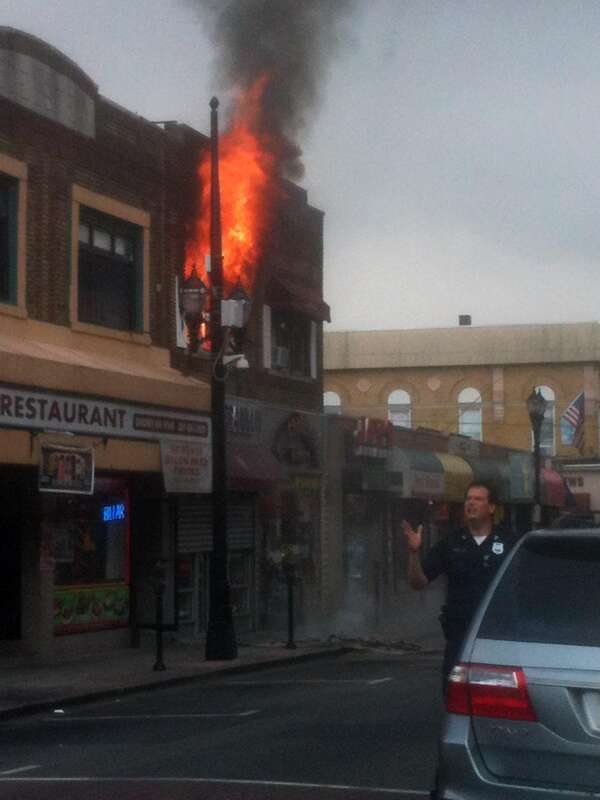 A fire at 4114 Bergenline Avenue in Union City, New Jersey on August 15, 2012. The fire started a short time before 12:45pm, when police officers first arrived on the scene, which was when I was passing by in a commuter van, and first saw what was