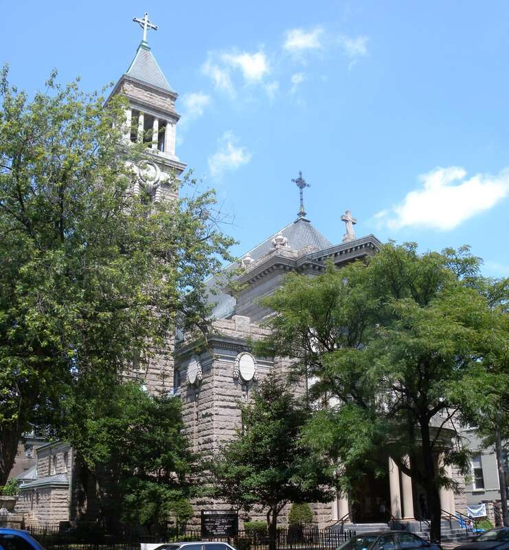 Looking northwest across West End Avenue at St Aloysius Church on a sunny midday.