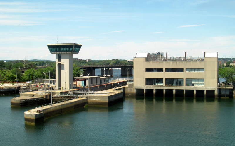 The Amelia Earhart Dam viewed from a passing MBTA train in July 2016