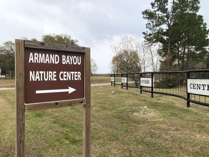 This is a sign pointing traffic towards Armand Bayou Nature Center off of Bay Area Blvd.