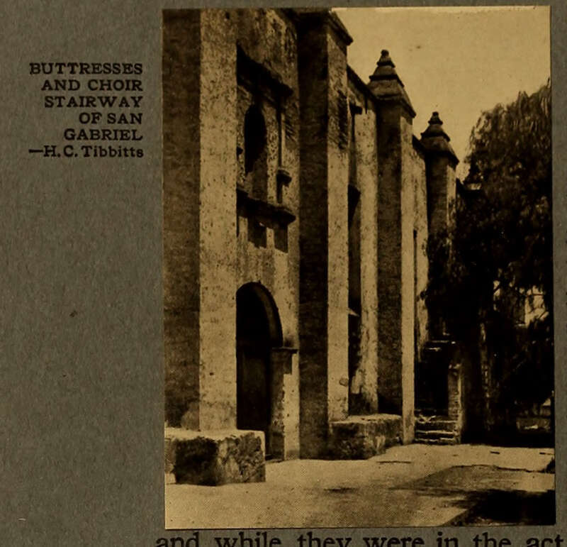Sepia toned photograph of San Gabriel with arched doorway, window, and trees to the right.