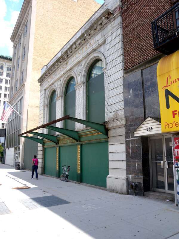 looking northeast along Broad Street at 836 Broad Street, the abandoned Broad Street terminal of Central Railroad of New Jersey, on a sunny midday.