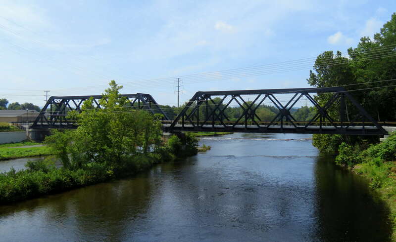 Former railroad bridge across the Westfield River seen in August 2018. Originally built for the New Haven and Northampton Railroad (Canal Line), it is now part of the Columbia Greenway Rail Trail.