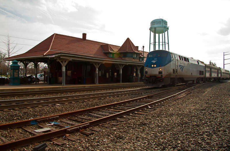 Amtrak 50, the Cardinal, is arriving in Manassas, Virginia on a warm Friday evening. The train left Chicago last evening and is on its way to New York City.  The station is shared with Virginia Railway Express commuters and hosts the city's visitors