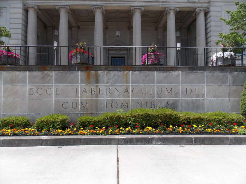 An etching on the entry steps at the Cathedral of the Blessed Sacrament in Altoona, Pennsylvania.  The Latin phrase means: &quot;Behold, the tabernacle of God is with human beings&quot;.