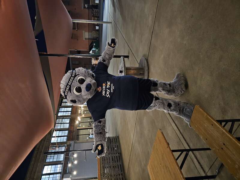 Chip, Rhide Ispand FC mascot, stands with his hands to the sides