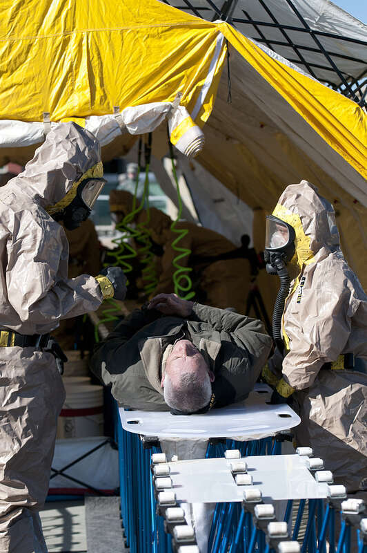 MARIETTA, Ga., Feb. 10, 2010 – Members of the Georgia’s Guard Joint Task Force 781, out of Kennesaw, wash down a civilian role player during the decontamination phase of a disaster preparedness exercise at Cobb County’s Public Safety Village. 
The