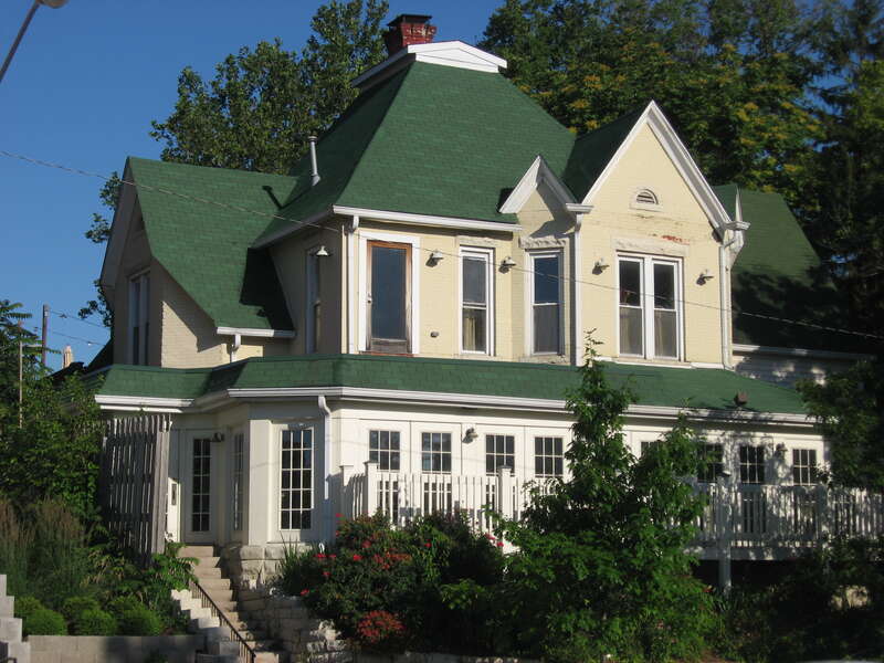 Front and southern side of the Scholars Inn restaurant, located at 717 N. College Avenue in Bloomington, Indiana, United States.  Built in 1895, it is part of the locally-designated Illinois Central and North College Historic District.