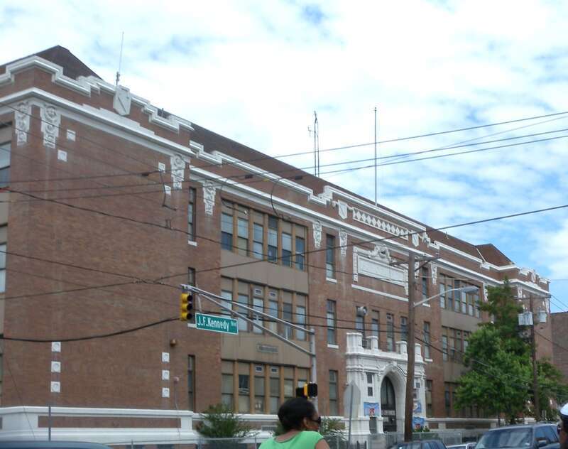 Looking north from Zabriskie St across JFK Blvd at Copernicus elementary school on a mostly cloudy midday.
