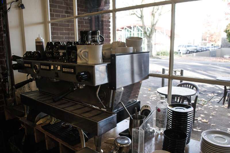 An espresso machine by the window