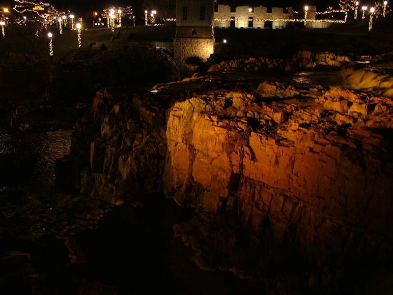 A view of the quartzite shoulders of the Sioux Falls bathed in a golden light.