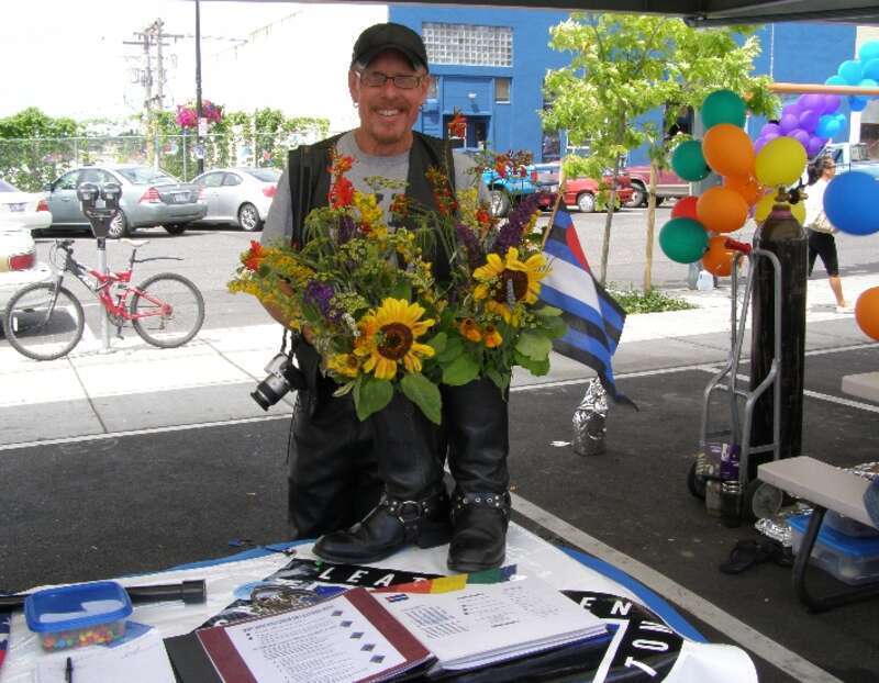 Leather boots as flower pots.  Booth for Bellingham Leathermen.