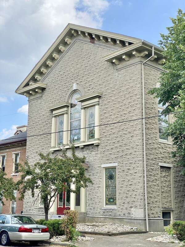 Built in 1866, this Classical Revival-style building served as the First German Methodist Church until 1914, after which it was renovated to its present appearance by a later congregation.  The building features a brick exterior clad in formstone, a