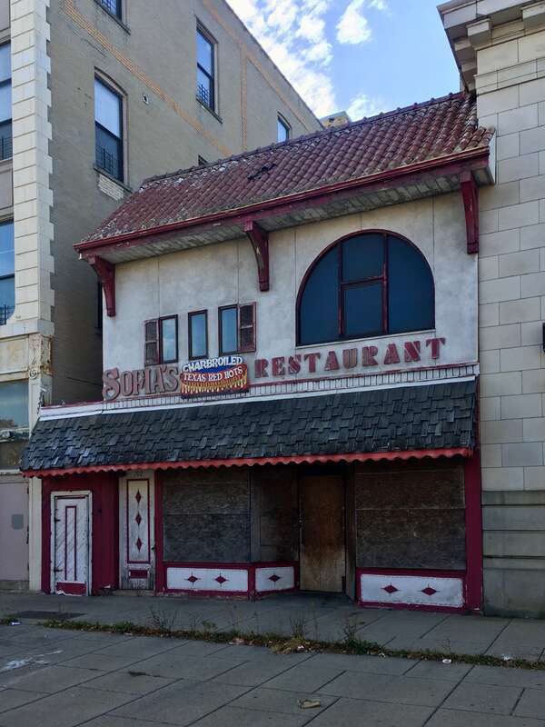 The building at 702 Fillmore Avenue, Buffalo, October 2019. Its most recent former tenant was Sofia's Restaurant (1989-prior to 2007); other previous ones include C&amp;amp;C Restaurant (1964-1989), Red Scissors Premium Store (as of the early 1960s), the