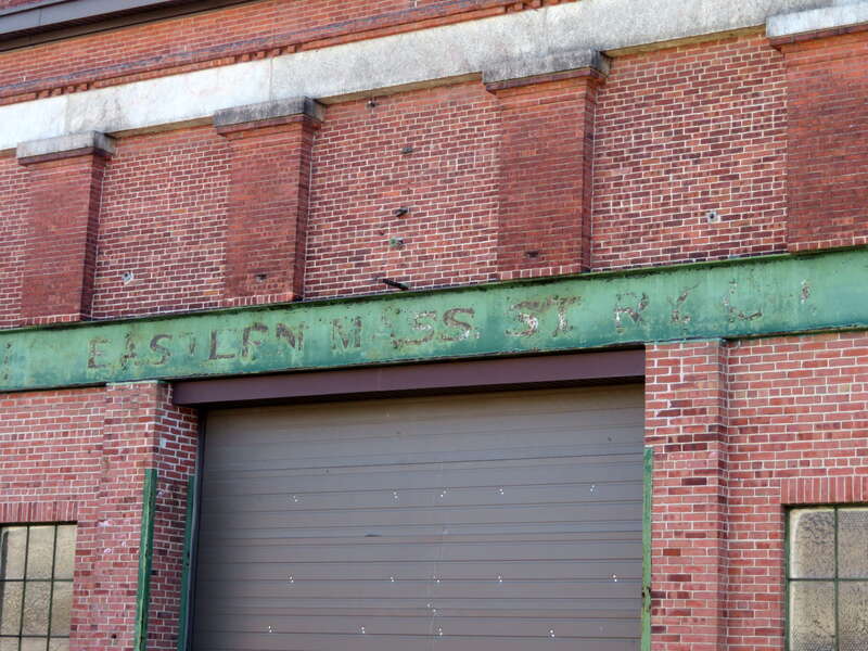 EASTERN MASS ST RY CO lettering on the former Taunton carhouse, seen in December 2021