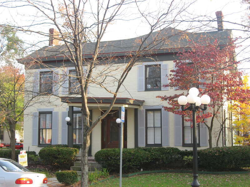Front and western side of the Holzman-Dill House (now Bruce Storm Real Estate), located at 322 E. Fourth Street in Bloomington, Indiana, United States.  Built in 1850, it is part of the locally-designated Restaurant Row Study Area.