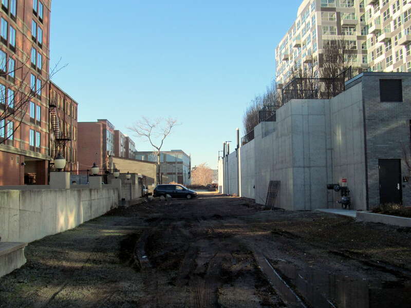 Green Line Extension right of way between a Hampton Inn at left and 22 Water Street (ZINC) at right