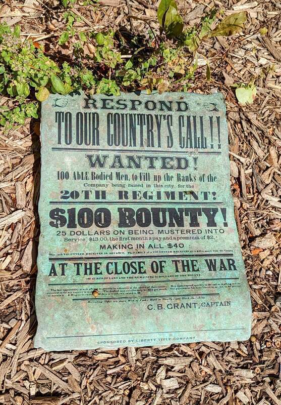 Statue of a poster advertising a government bounty for soldiers willing to fight in the Civil War. Located in Ann Arbor, Michigan.