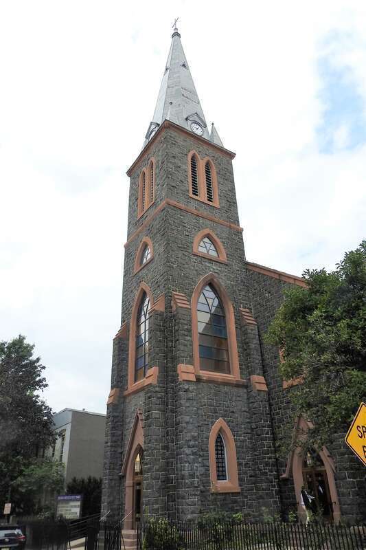 Looking north at steeple on a mostly cloudy day