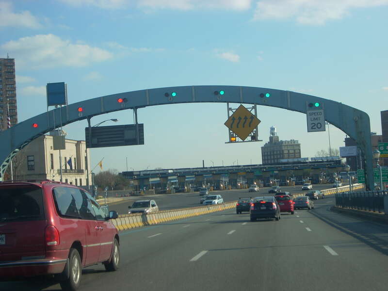 This is the point where all eastbound traffic must reduce their speed to 20 MPH to circumvent the westbound toll barrier in the opposite direction, causing lane shifts the opposing direction. Tolls are set at $4 currently for 4-wheel passenger cars