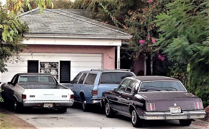 Three cars parked on a driveway