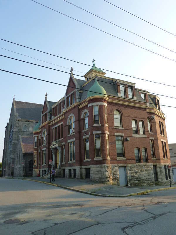 Immaculate Conception Church, a Roman Catholic Church located at 144 East Merrimack Street, Lowell, Massachusetts.  East and north sides of building shown.