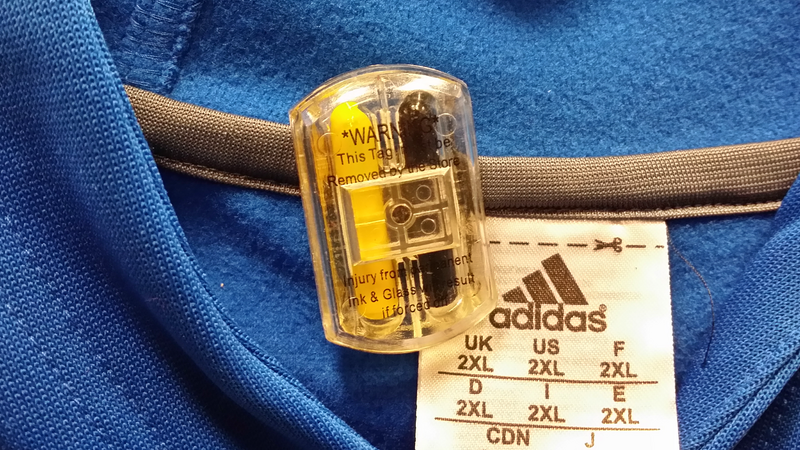 Ink tag attached to clothing being sold at the Macy's store at Lakeforest Mall in Gaithersburg, Maryland.

Ben Schumin is a professional photographer who captures the intricacies of daily life.  This image may be used under Creative Commons